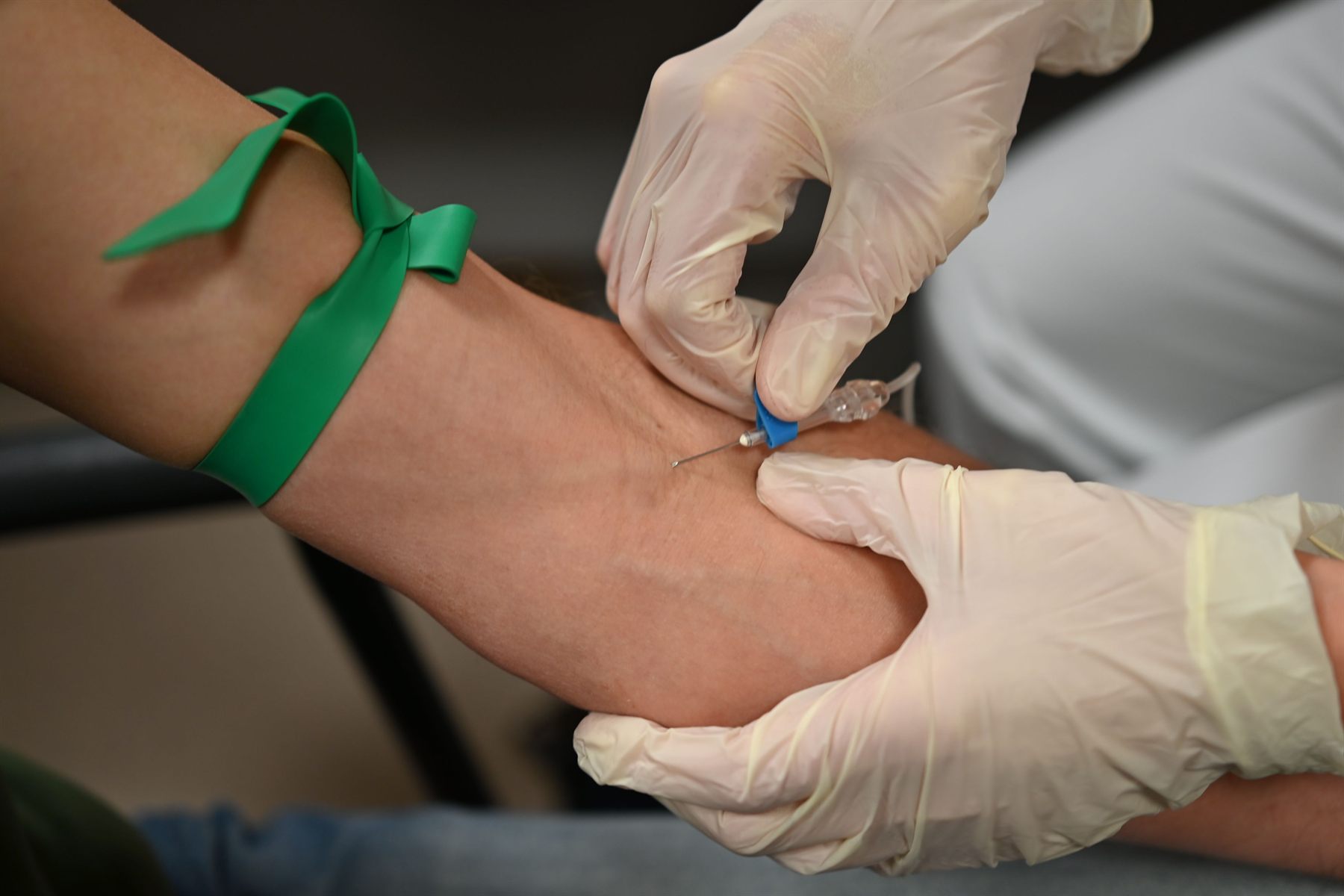 Close-up of professional phlebotomy blood draw practice.